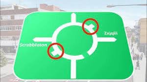 Roundabout sign shows stubby roads