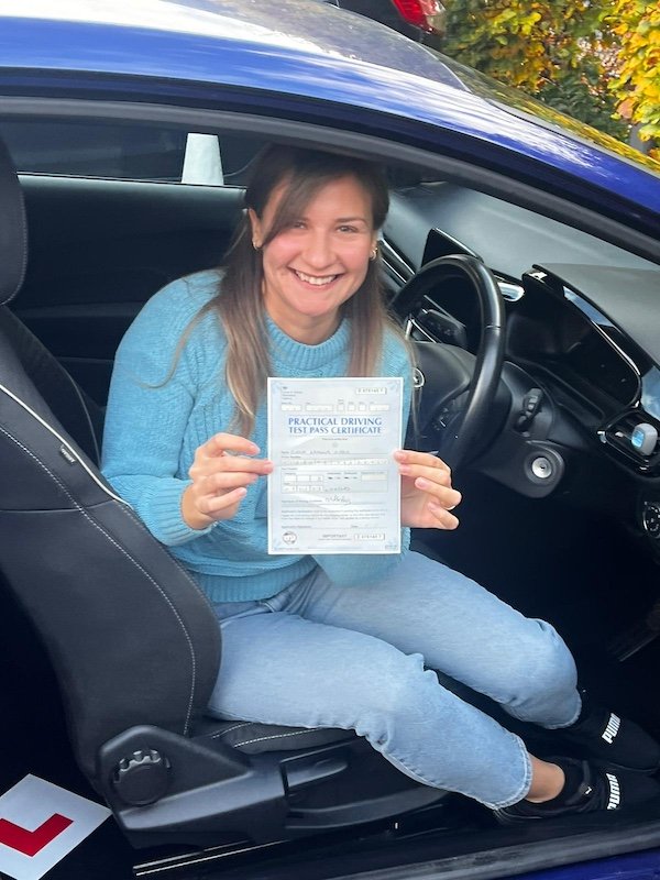 Lady with driving test success certificate 