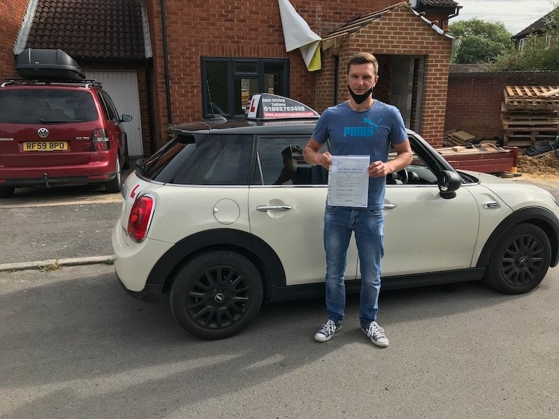 Oxon Driving Tuitions driving learner holing a driving test success certificate